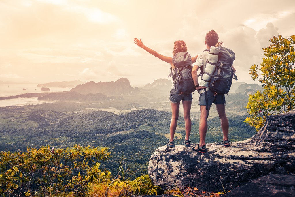 women on top of a mountain