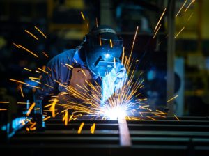 man welding metal