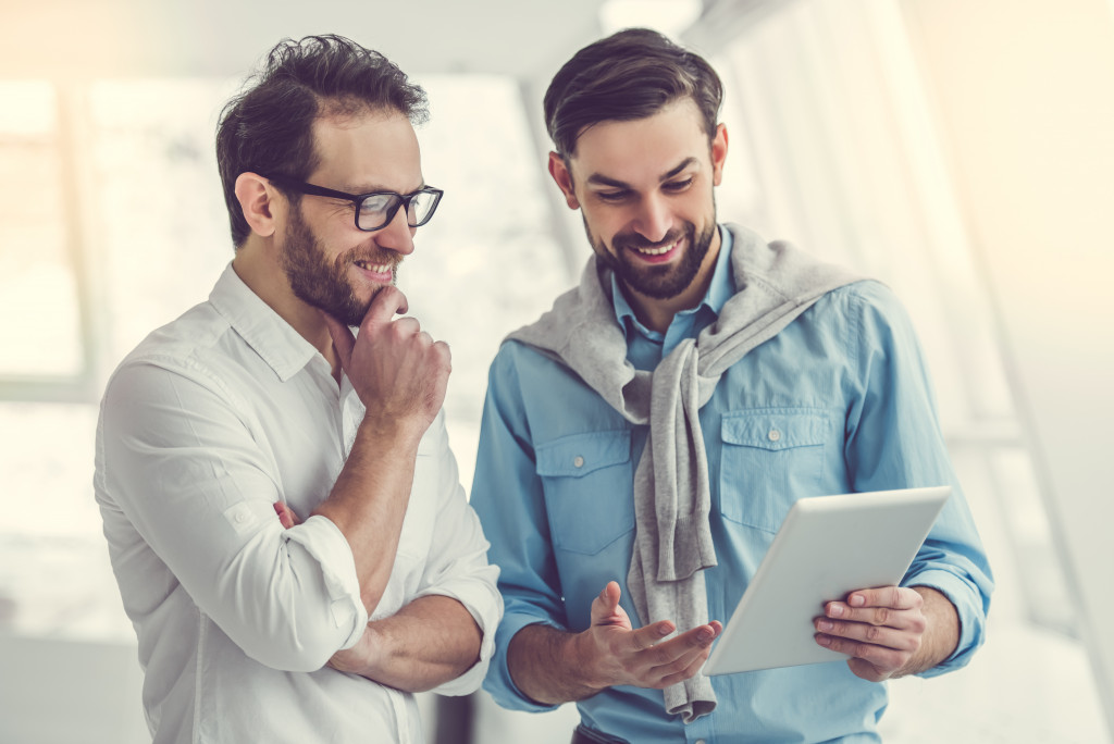 men using a digital tablet