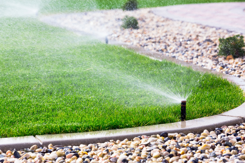 a lawn with sprinkler