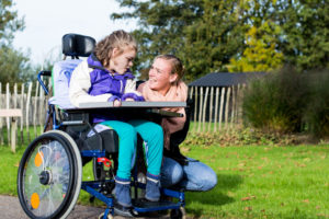 a child on a wheelchair