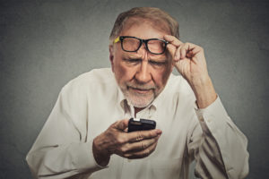 elderly man on a phone