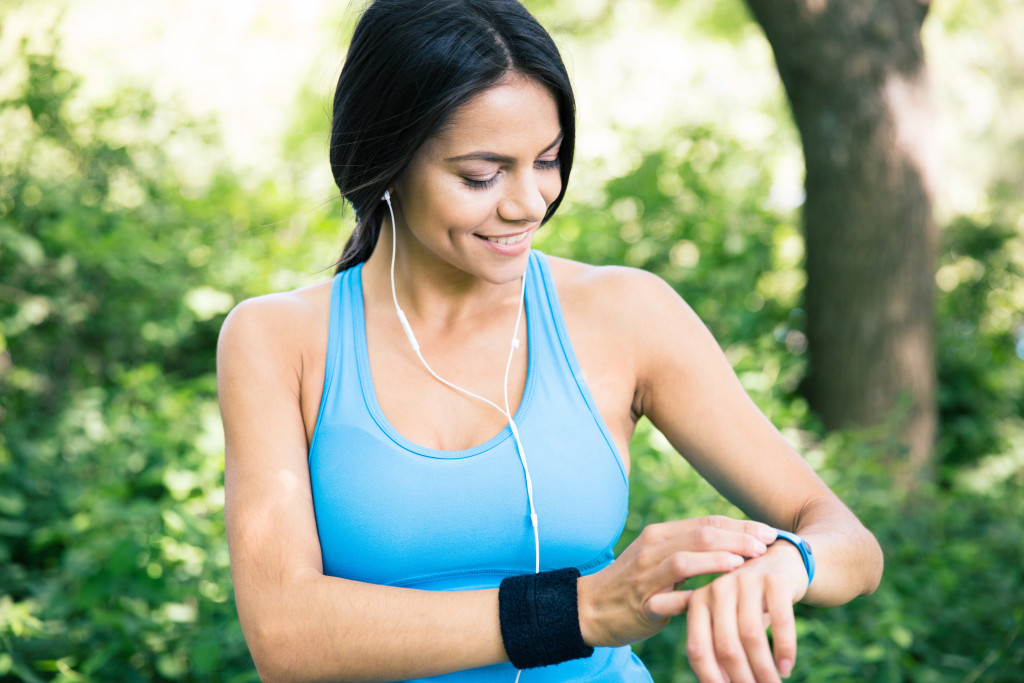 woman using her smartwatch