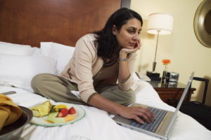 Businesswoman with laptop and food