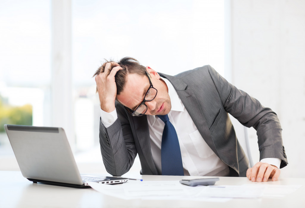 entrereneur calculating and feeling stressed