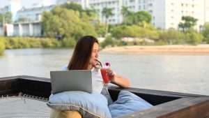 woman on vacation using her laptop