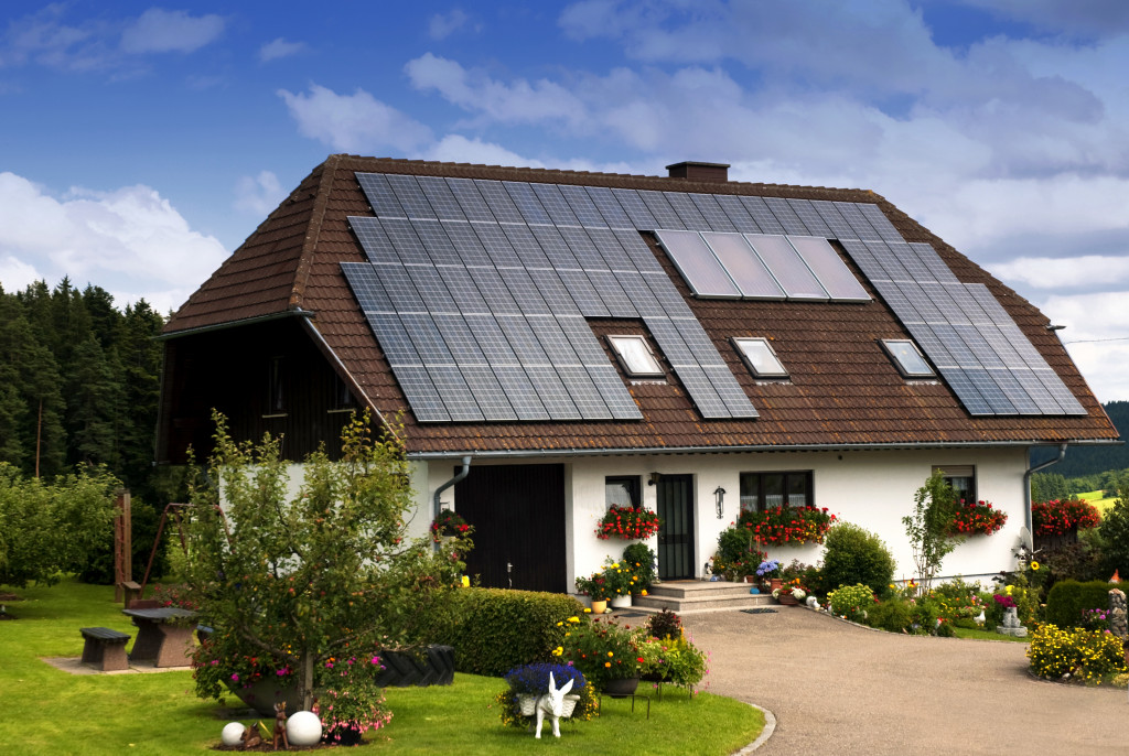 a house with solar panels and greenery