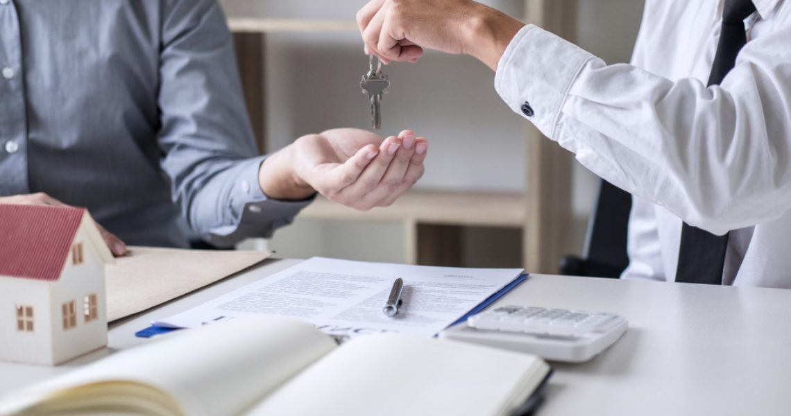 handing out key to a property